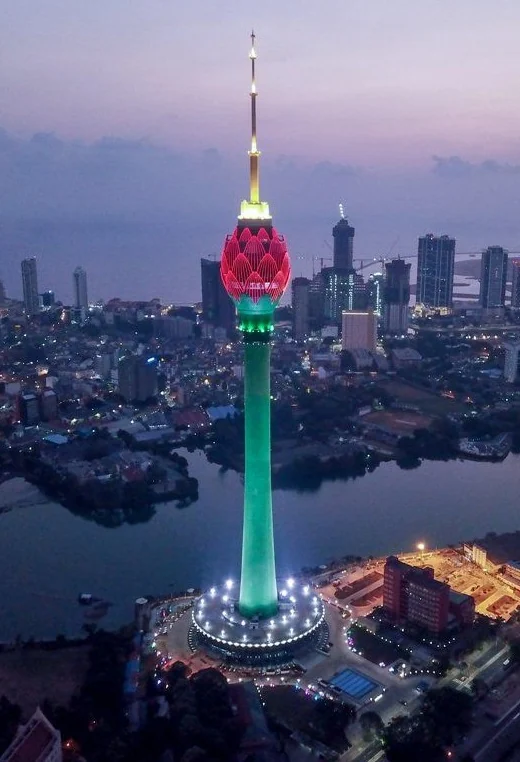 Colombo Lotus Tower lit up at dusk above the city skyline